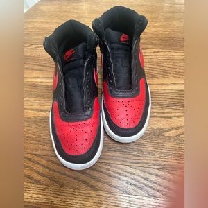 Nike red and black shoes.